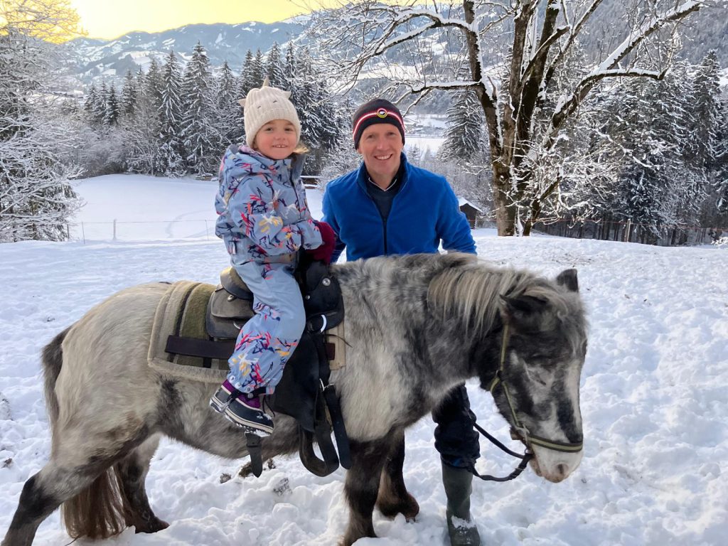Children Feed Goats on Green Farm in Salzburger Land, Family Vacation with Animals